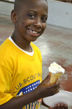 Young cub scout enjoys his ice cream made with liquid nitrogen.