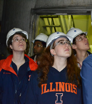 CEE 398 students examine Abbott Power Plant's smoke stacks during a tour of the power plant.