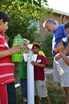 Uni High summer campers and Bob Coverdill prepare to launch bottle rocket.