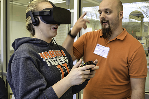A UHS student gets instructions during her virtual reality experience at DNA & Health Day.