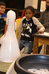 Local DREAAM House boys experience how liquid nitrogen can impact various materials.