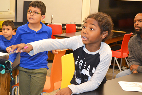 DREAAM House youth engage with Uni teacher David Bergandine during his liquid nitrogen demo.