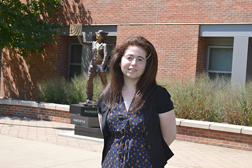 One of the women engineers featured in the book, Amy Doroff, a recent ISE graduate, in front of the Quintessential Engineer statue.