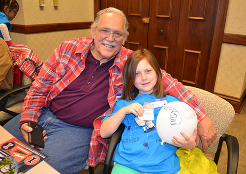 A Mahomet grandfather and his grandaughter enjoying Dads 4 Daughters.