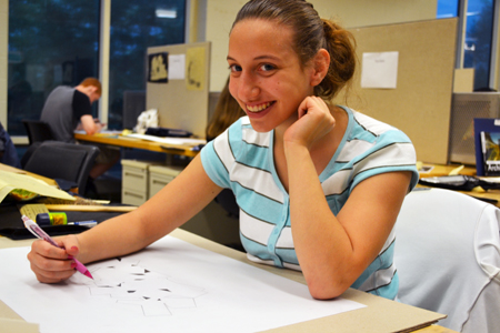  discover architecture camper draws the model she designed.