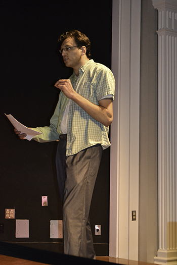 Hani Awni presents a spoken word during the final session of the class called STEMposium