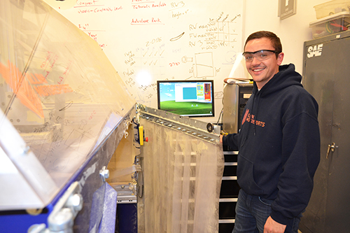 Aerodynamics Team leader Alex Allmandinger shows some of the equipment they use when contructing their racecar.