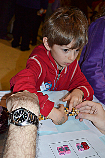 Local youngster learns about dominance and co-dominance in genes by studying calico corn.