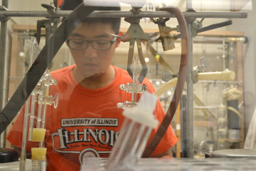 David Gong analyzes bone samples in Dr. Kristin Hedman's lab.