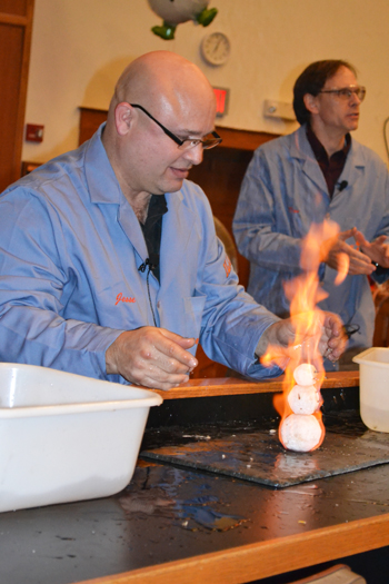 Jesse Miller prepares to douse a flaming snowman.