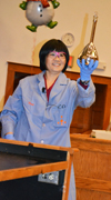 Tina Huang exhibits a flask she "turned silver" by shaking the contents together.