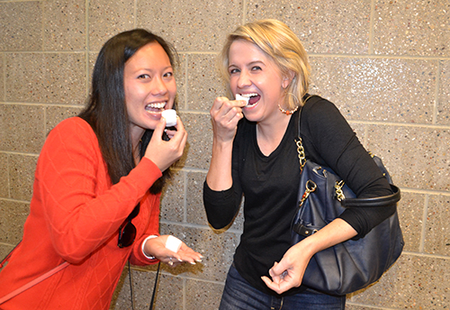 Abby Houser (right), and a friend valiantly agree to be photographed while preparing to chomp on their liquid-oxygen-frozen marshmallows.