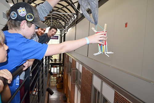 Brandon Roady, a Mahomet Seymour 7th grader, prepares to test his team's egg drop lander.