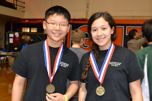 Two Marie Murphy contestants receive their gold medals.