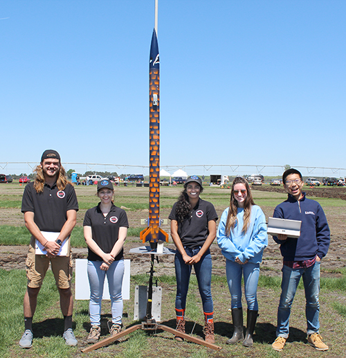 Illinois Space Society members with their rocket.
