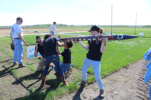 Members of Illinois Space Society setting up their rocket for launch.