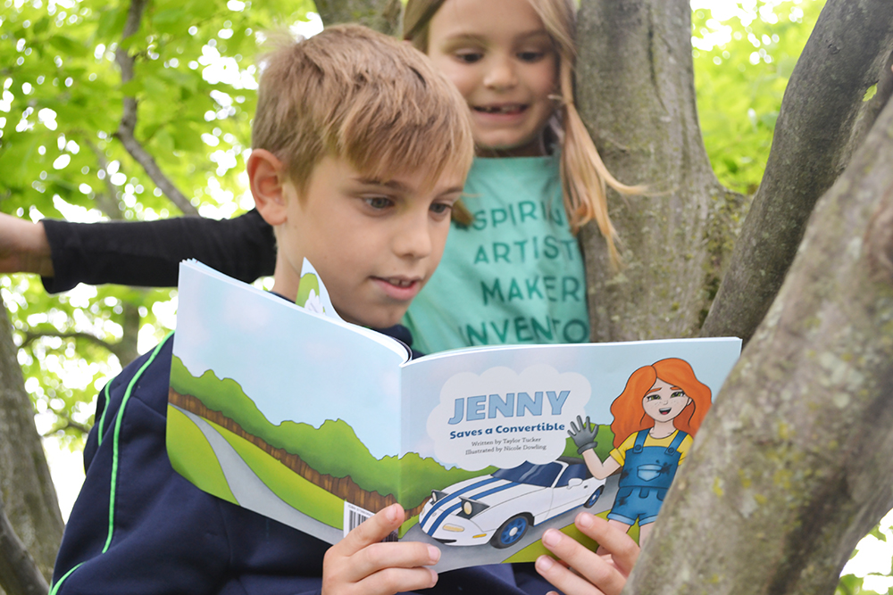 Local youngsters enjoy <em>Jenny Saves a Convertible</em>, written by Illinois alumns Taylor Tucker and Nicole Dowling.