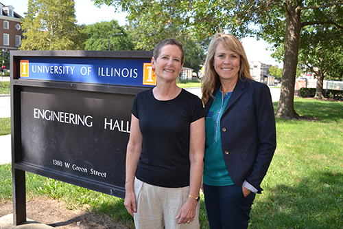 Laura Hahn (left) and Angie Wolters (right) in front of the Engineering Hall sign.