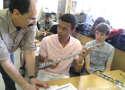 Science teacher David Stone discusses procedures for using the Lego kits with students during the evaluation session
