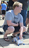 An ME370 student prepares to race his automaton.