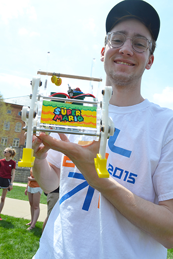 One of Leon Liebenberg's students exhibits the walker he and his teammates designed which he has just finished racing during the competition. To see the process the team went through to design and build the Super Mario, click here to see teammate Kate Malmsbury's e-portfolio.