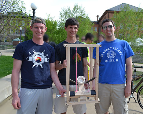 An ME 370 team that drenched 3 professors on 3 for 5 shooting display their prize-winning BLAM design.