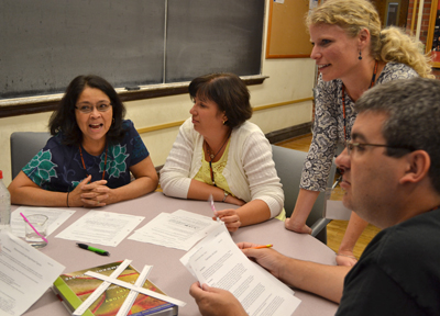 Gretchen Adams works with teachers during the chemistry activity session.