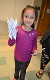A young visitor exhibits the model she made of graphene for flexible electronics.