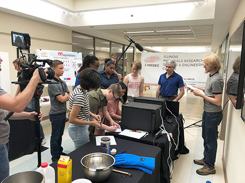 Still shot from an episode of Magnetic Fields; during this scene, the group of students is attending the I-MRSEC Open House held in the Materials Research Lab. (Image courtesy of Pamela Pena Martin.) 