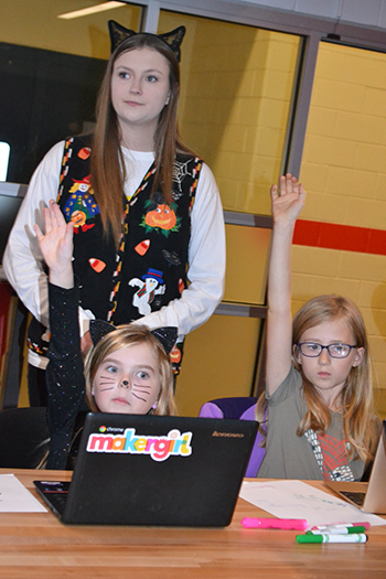 Mary Hadley with two young MakerGirl visitors.