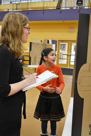 Psychology Professor Kara Federmeier enjoys an NGS student's presentation.