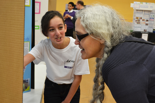 NGS student and Illinois expert enjoy the student's presentation.