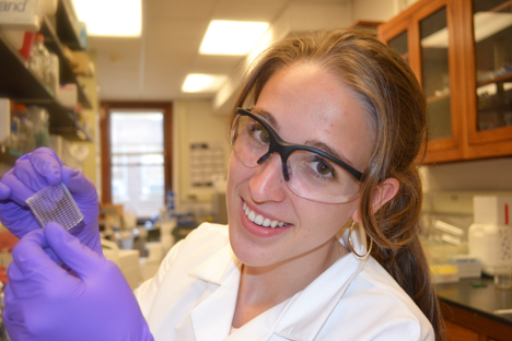 Morgan Elliot displays some of her work in the lab.