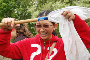 Student uses bug net at Pollinatarium.