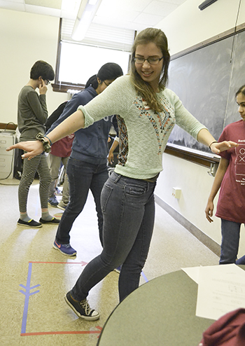 Participant in Sonia Math Day playing one of the math games related to a torus.