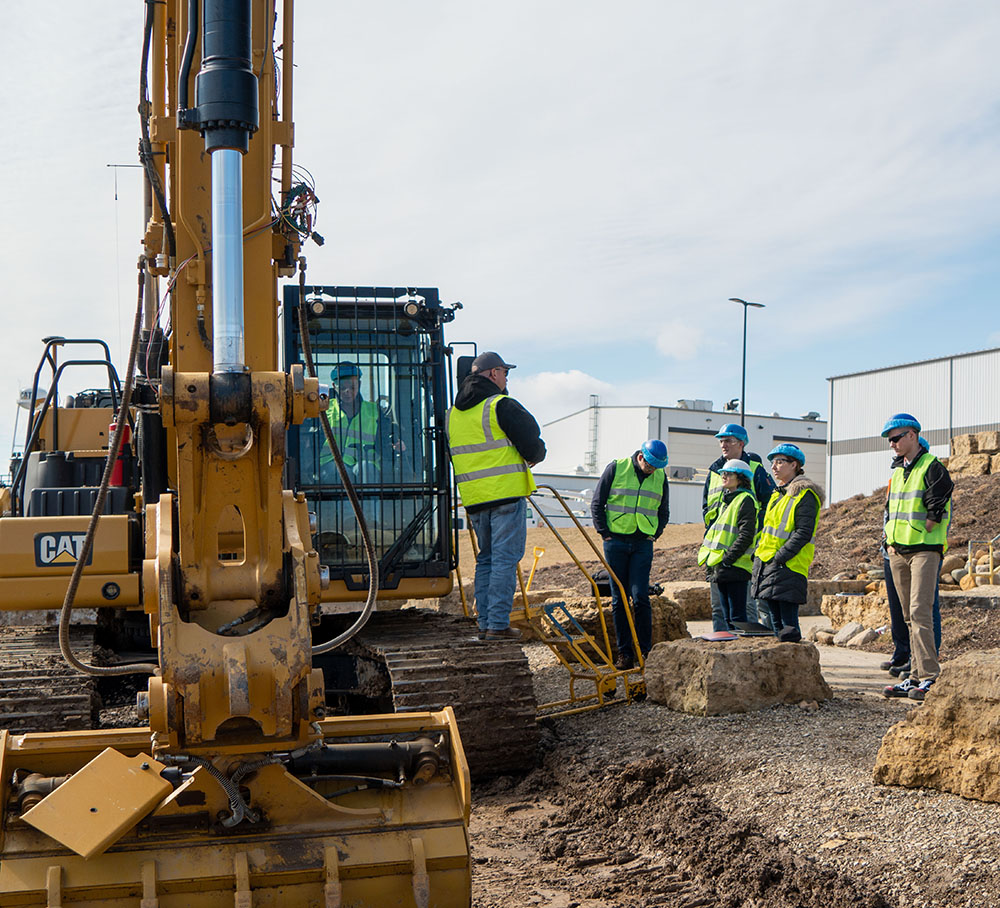 Team 36 and Dylan Taylor see some of Caterpillar's big machines up close at its Peoria plant. Image courtesy of Team 36's final presentation.