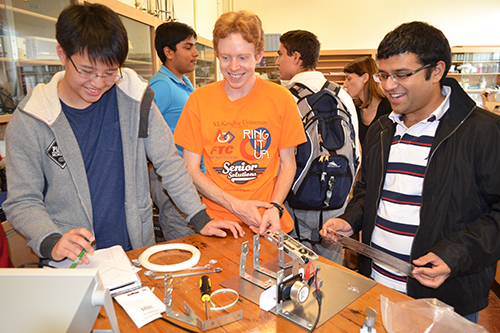 Two Uni High students and Guarav Bahl (right)