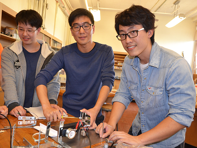 Benjamn Sohn (center) and Shengtai Daniel Shi (right),