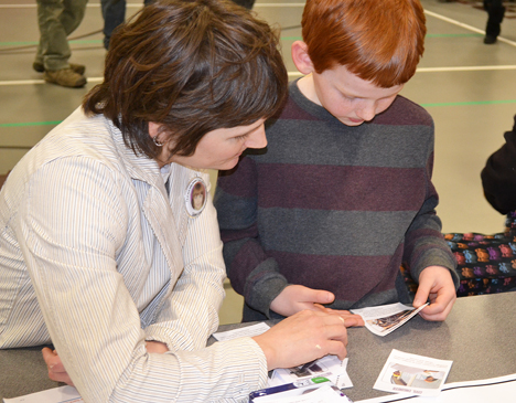 A mother and son discover what engineers in the different engineering disciplines do while waiting for one of the main events 