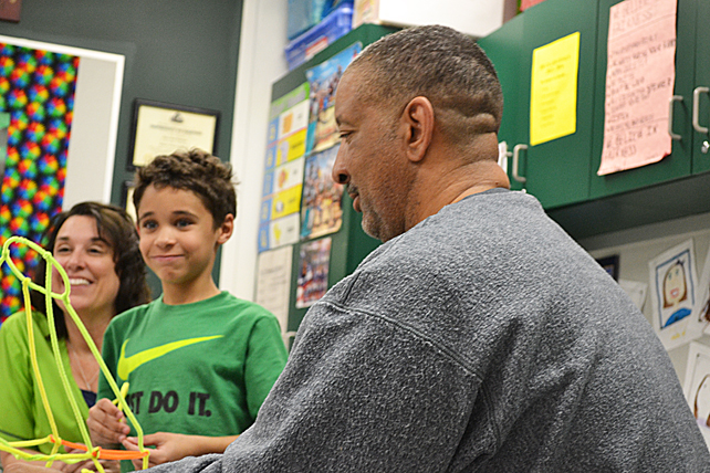 The family of a Unity East student team up to build a tower out of pipe cleaners.