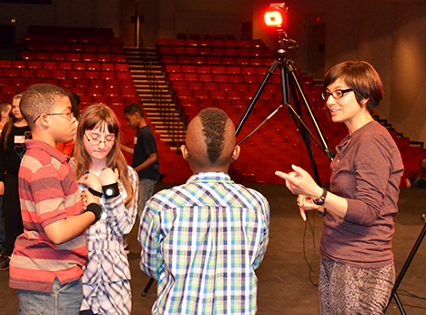 Lopez works with a small group of 5th graders during their visit to Krannert.