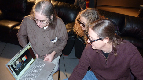 Stuart, Donna, and Bob collaborate with a client during a project.