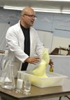 Jesse Miller performs a demonstration with hydrogen peroxide and soap.