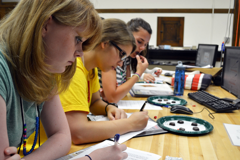 GLAM campers perform lab analyzing the material chocolate.