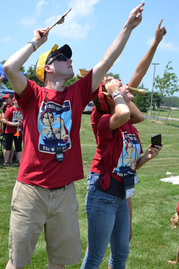 Brian Woodard and a couple of GAMES campers follow the flight of one of the girls' rockets.