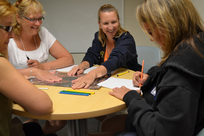 Teachers enjoying hands-on activity during iRISE 2012 summer workshop.