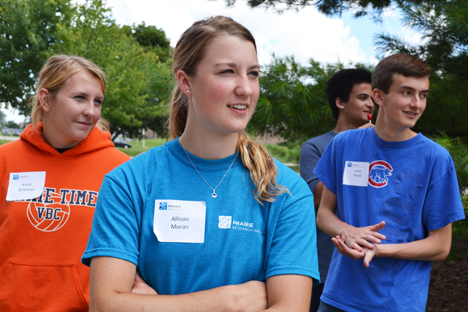 Left to right: PRI camp counselors Katie Wildman and Allison Moran and two campers enjoy watching other campers drive the go-cart.