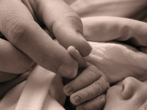 Baby's finger is being measured.