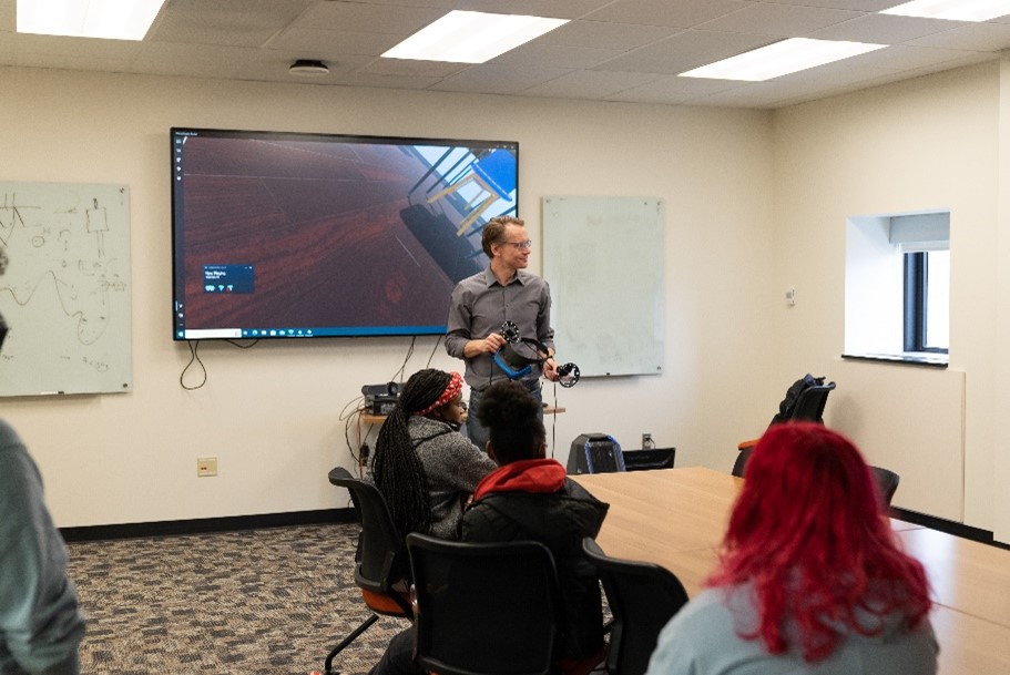 Prof. Andre Schleife introduces the Franklin group to virtual reality and materials science. Photo by Virgil Ward